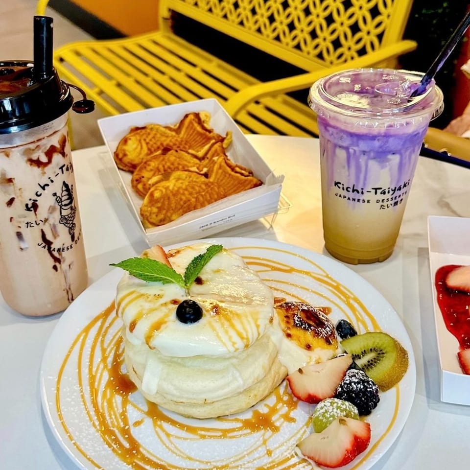 Delicious Kichi-Taiyaki Japanese desserts including fluffy pancakes, taiyaki, and two beverages.